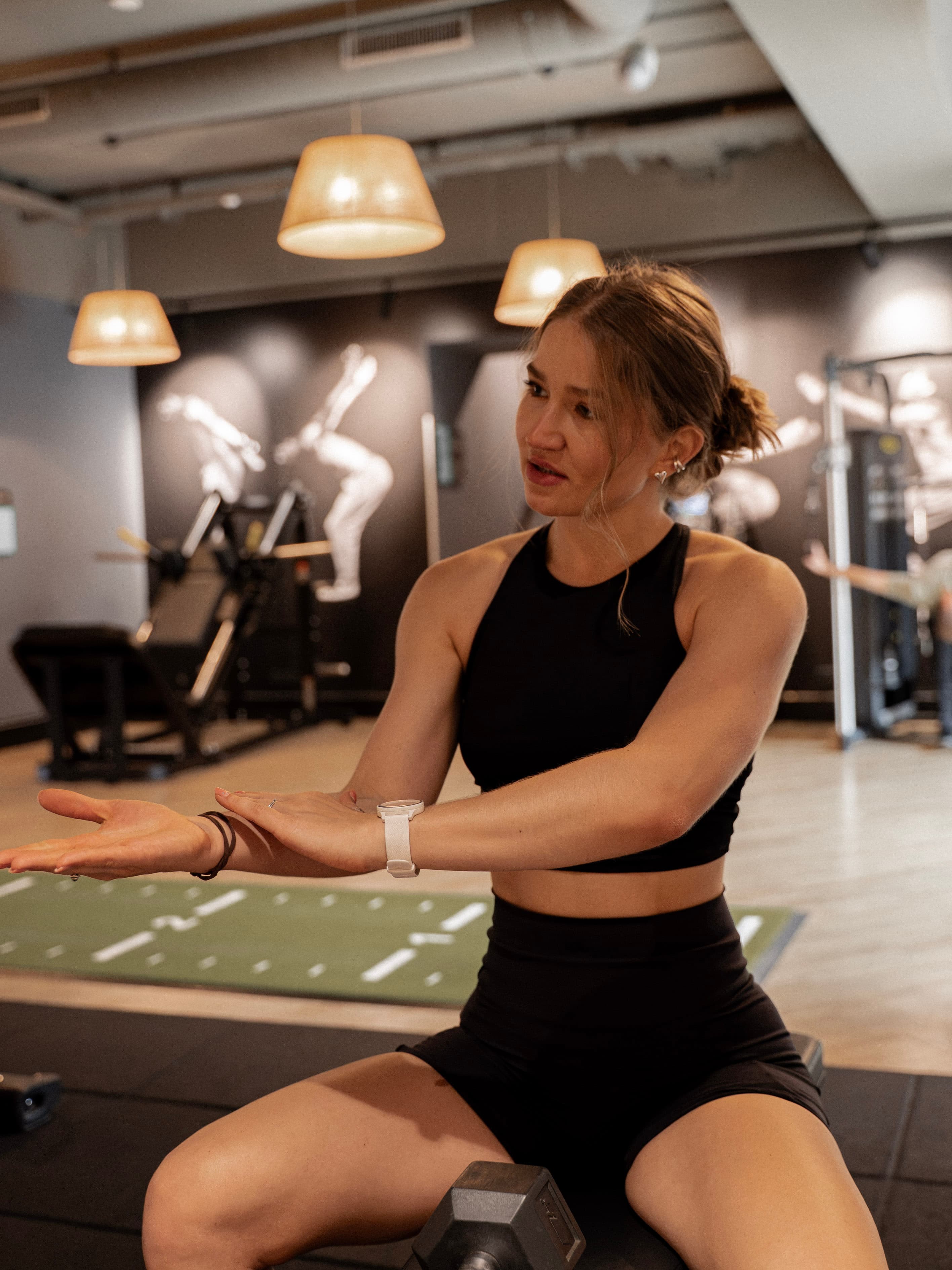 Solomiia explaining a movement in the training studio.