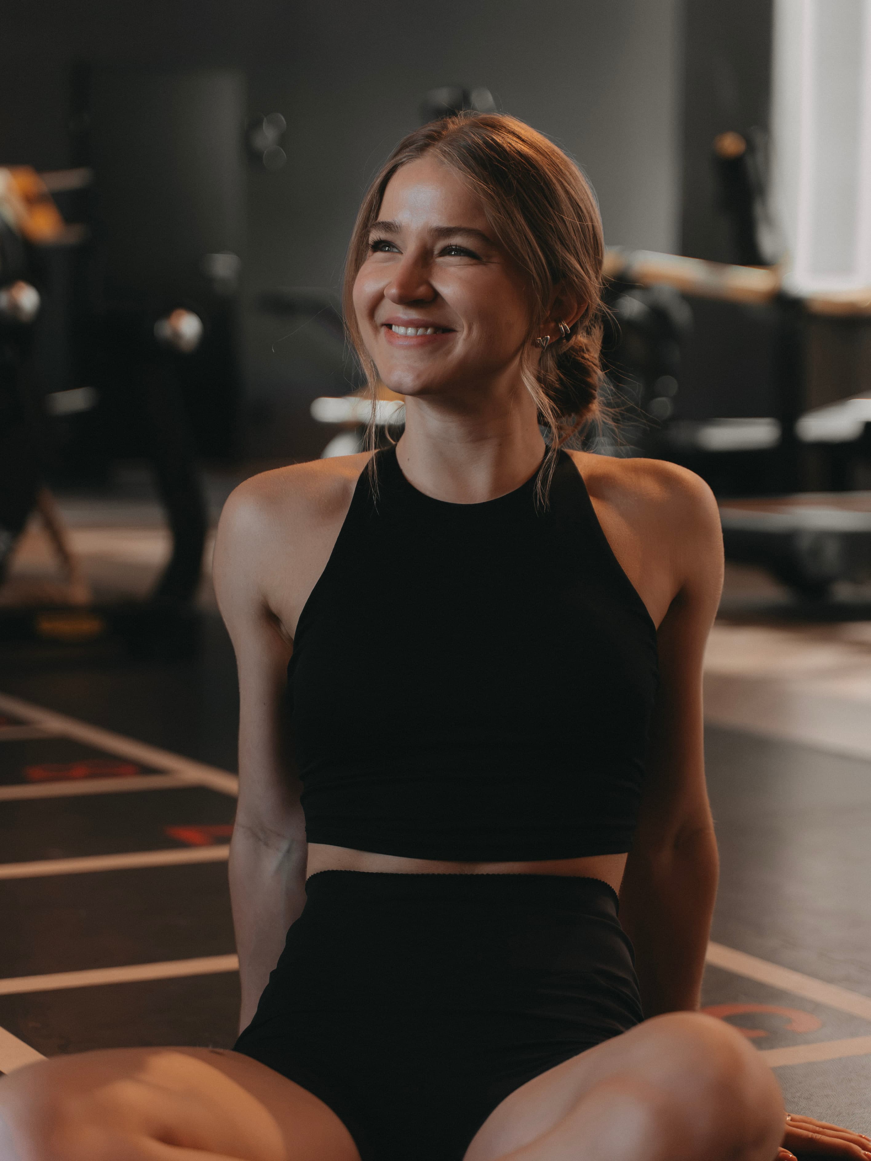 Solomiia smiling in the training studio.